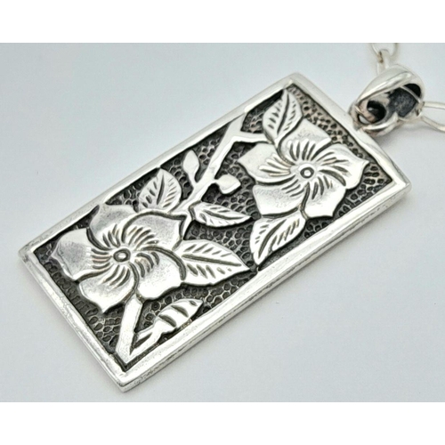 651 - SOLID SILVER INGOT with carved decoration mounted on a quality SILVER CHAIN LINK NECKLACE.  Ingot x ... 