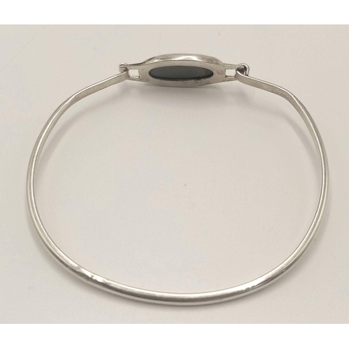 824 - A Hallmarked Silver 1984 Dated Faceted Oval Onyx Bracelet. Sprung Design, Inner Width 6.3cm. Gross W... 