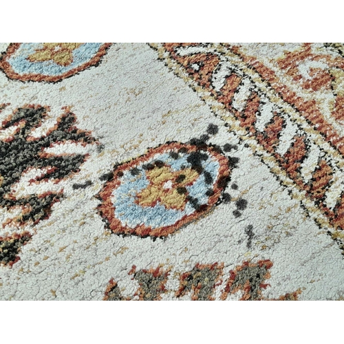 928 - A Cream Cashmere Patterned Rug, Measuring 200 x 290cm. See photos for condition and design.