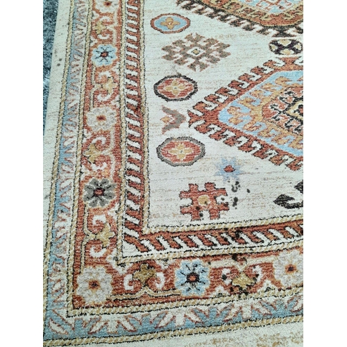 928 - A Cream Cashmere Patterned Rug, Measuring 200 x 290cm. See photos for condition and design.