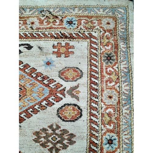 928 - A Cream Cashmere Patterned Rug, Measuring 200 x 290cm. See photos for condition and design.