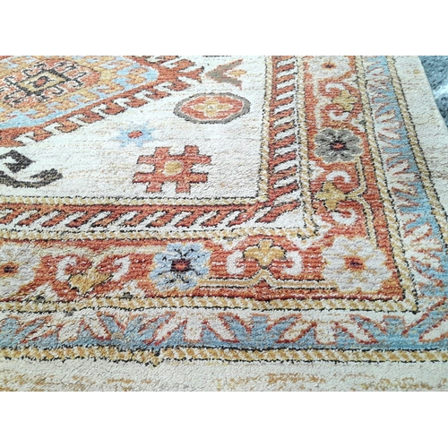 928 - A Cream Cashmere Patterned Rug, Measuring 200 x 290cm. See photos for condition and design.