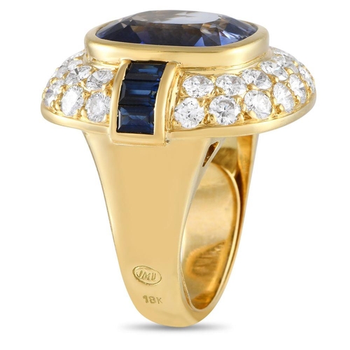 851 - A 18K Yellow Gold 2.25ct Diamond and Tanzanite Ring.  8.37 carats Deep blue tanzanite gemstones  are... 