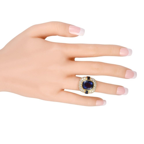 851 - A 18K Yellow Gold 2.25ct Diamond and Tanzanite Ring.  8.37 carats Deep blue tanzanite gemstones  are... 