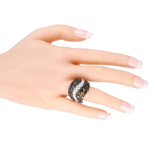 865 - A Bucherer 18K White Gold 10.86ct Black and White Diamond Ring.  Alternating bands of black diamonds... 