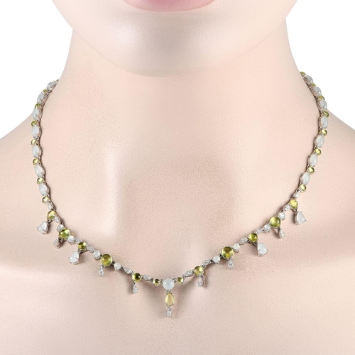 967 - A Bucherer 18K White Gold 0.55ct Diamond, Aquamarine and Peridot Necklace. The necklace is crafted i... 