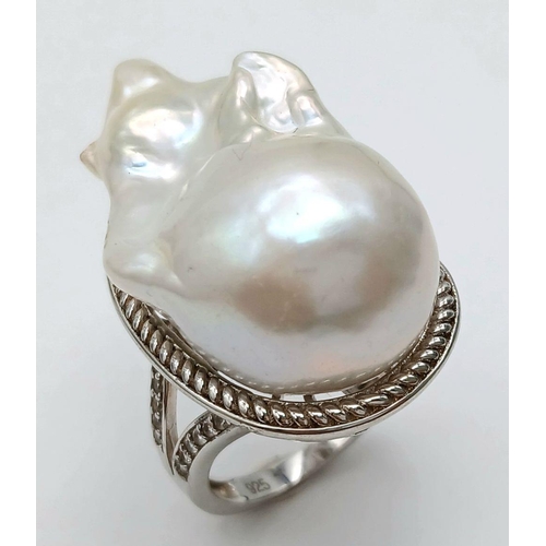 1217 - A Unique Sterling Silver Baroque Pearl Set Statement Ring Size N. The Crown measures 3.2cm Length. G... 