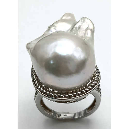 1217 - A Unique Sterling Silver Baroque Pearl Set Statement Ring Size N. The Crown measures 3.2cm Length. G... 