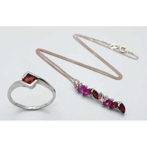 1460 - A matching set of 925 sterling silver, featuring a drop pendant necklace with pink, red, and cubic z... 