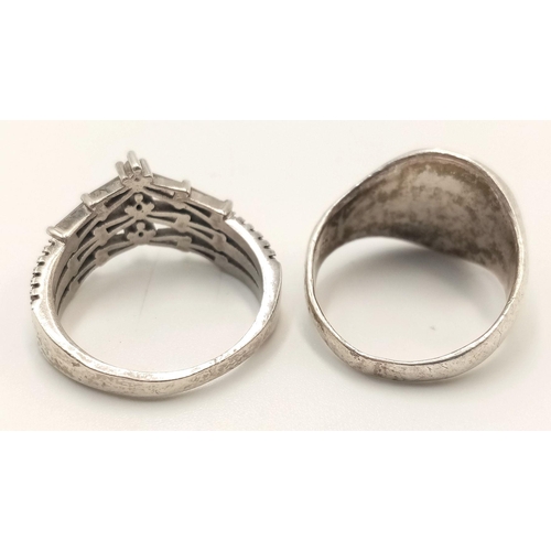 1597 - Two sterling silver rings, ring sizes M 1/2 and O 1/2, weighing a total of 8.2g. One ring showcases ... 