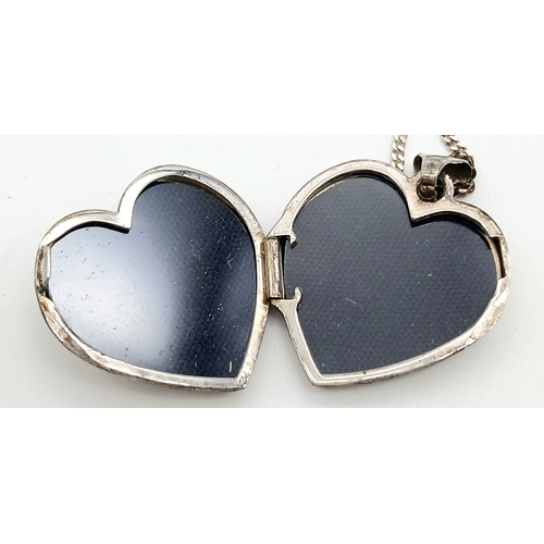 1650 - A Sterling Silver Heart Locket on a 925 Silver Disappearing Necklace. 46cm and 2.5cm.