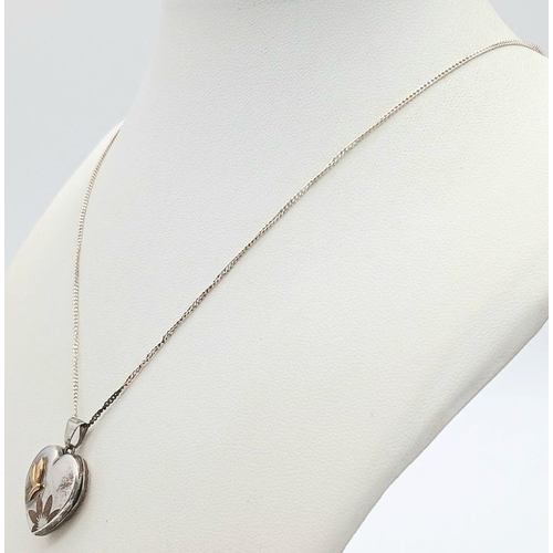 1650 - A Sterling Silver Heart Locket on a 925 Silver Disappearing Necklace. 46cm and 2.5cm.