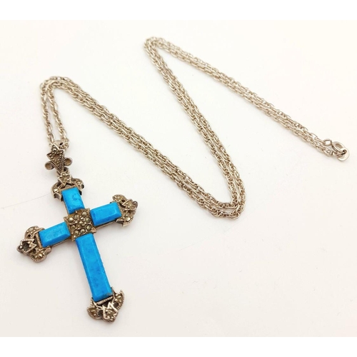 1661 - A Sterling Silver Turquoise Cross Pendant with Chain. 4cm and 56cm. 16g