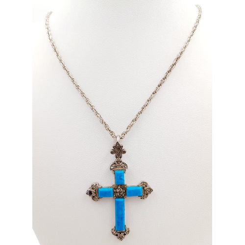 1661 - A Sterling Silver Turquoise Cross Pendant with Chain. 4cm and 56cm. 16g