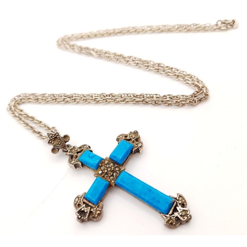 1661 - A Sterling Silver Turquoise Cross Pendant with Chain. 4cm and 56cm. 16g