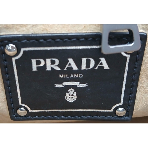 565 - A Classic Prada Black Leather Shoulder/Tote Bag. Soft black calfskin exterior with silver tone hardw... 