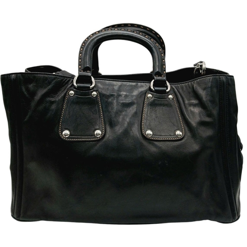 565 - A Classic Prada Black Leather Shoulder/Tote Bag. Soft black calfskin exterior with silver tone hardw... 