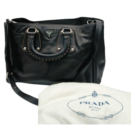 565 - A Classic Prada Black Leather Shoulder/Tote Bag. Soft black calfskin exterior with silver tone hardw... 