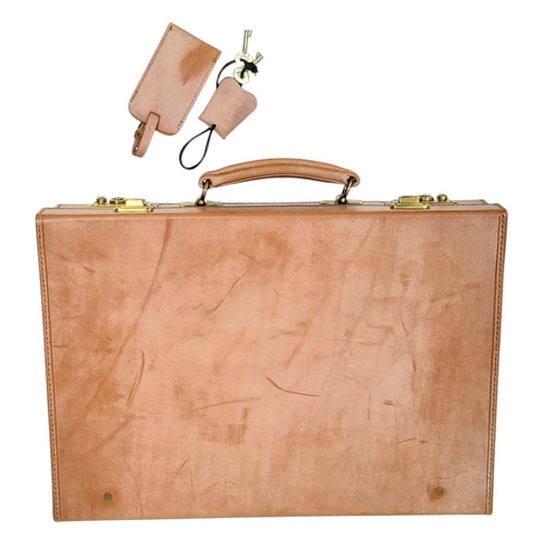 793 - A Tan leather Attache case, by Simpson of London, 33x43 cm, unused, slightly shop soiled