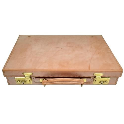 793 - A Tan leather Attache case, by Simpson of London, 33x43 cm, unused, slightly shop soiled