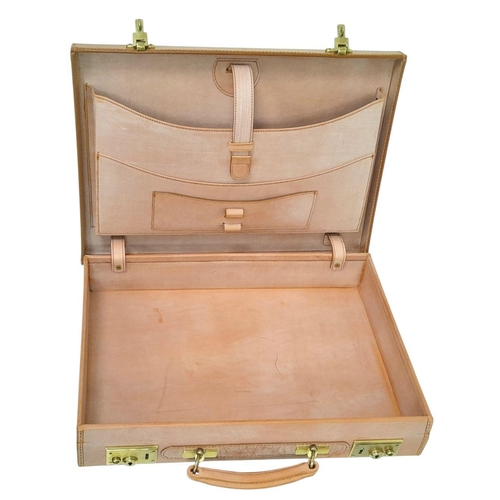 793 - A Tan leather Attache case, by Simpson of London, 33x43 cm, unused, slightly shop soiled