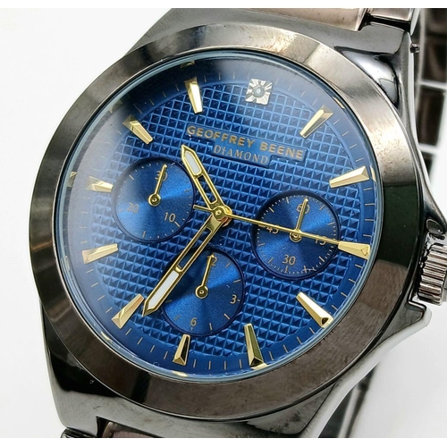 797 - A Geoffrey Beene Diamond Quartz Gents Watch. Stainless steel bracelet and case - 42mm. Blue dial wit... 