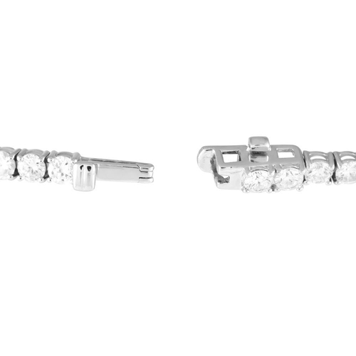 1234 - A 14K White Gold 5.01ct Lab-Grown Diamond Tennis Bracelet. It is 7.5 inches long and features sixty-... 