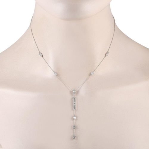 1382 - A 14K White Gold 0.90ct Diamond Necklace. Five diamond clusters - four in marquise-shaped frames and... 