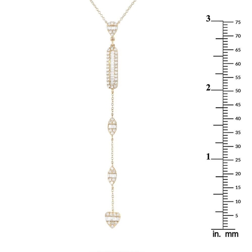 1403 - A 14K Yellow Gold 0.70ct Diamond Necklace. It features petite clusters of round and baguette diamond... 