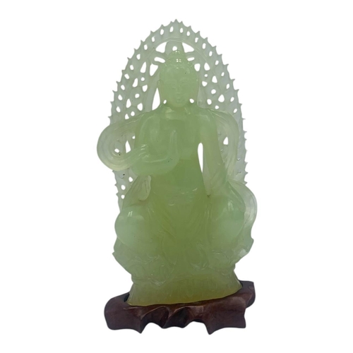 1656 - An Antique Chinese Jade Buddha Statue. 
Light green jadeite  with finely hand carved details depicti... 