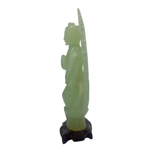 1656 - An Antique Chinese Jade Buddha Statue. 
Light green jadeite  with finely hand carved details depicti... 