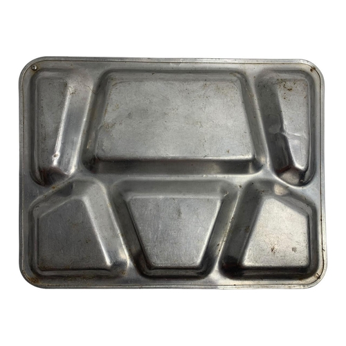 864 - A Vietnam War era U.S. military mess kit including a six-compartment mess tray and a set of four sta... 