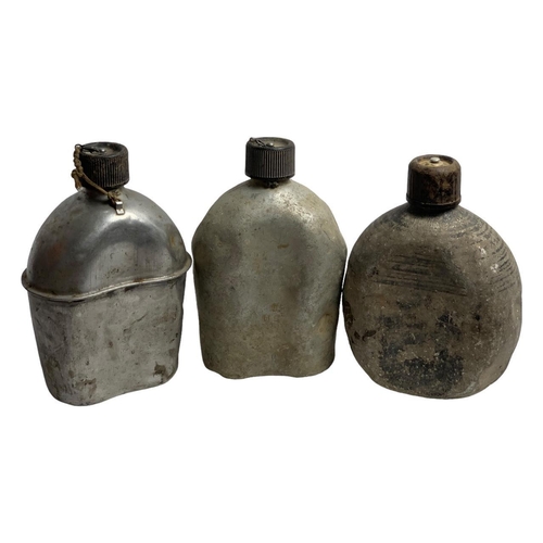 899 - Five Vietnam War era U.S. Army metal canteens, including three aluminum canteens dated 1951-1953, me... 