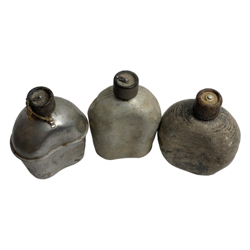 899 - Five Vietnam War era U.S. Army metal canteens, including three aluminum canteens dated 1951-1953, me... 