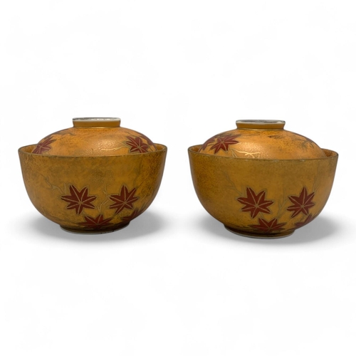 1142 - A Pair of Sakae Kutani Japanese lidded Bowls.
Yellow and red glazed porcelain exterior with maple le... 