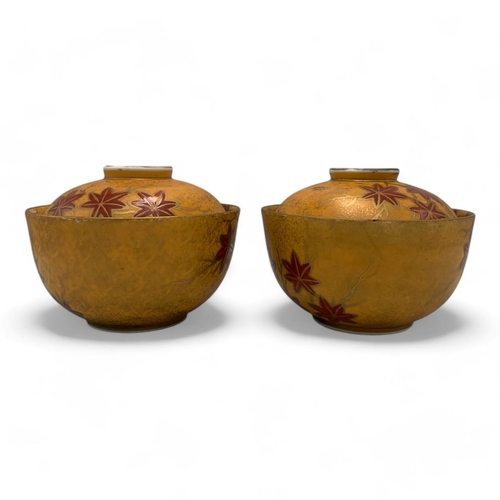 1142 - A Pair of Sakae Kutani Japanese lidded Bowls.
Yellow and red glazed porcelain exterior with maple le... 