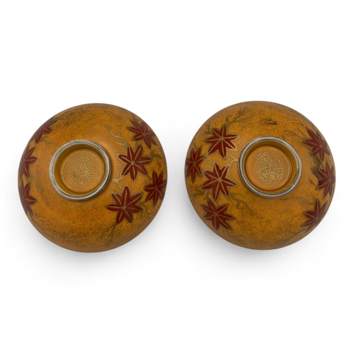 1142 - A Pair of Sakae Kutani Japanese lidded Bowls.
Yellow and red glazed porcelain exterior with maple le... 