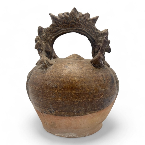 1163 - A 16th century Quang Duc Vietnamese Ceramic mineral lime pot featuring a rounded body and ornate han... 