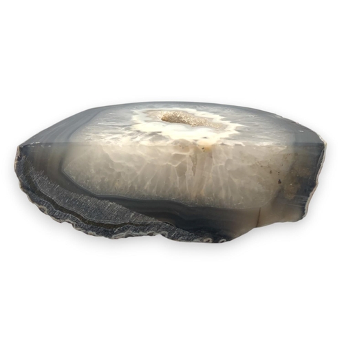 1220 - A Natural wonder Agate Geode slide collector's item.
Gray, white, and natural tones with a polished ... 