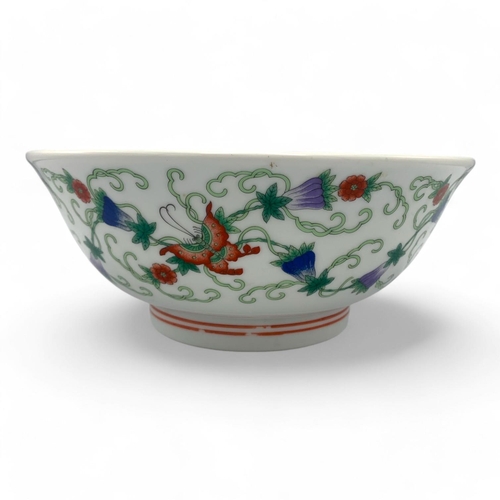 1397 - An antique Chinese Porcelain Bowl with Floral and Butterfly Design. White porcelain with green, red,... 