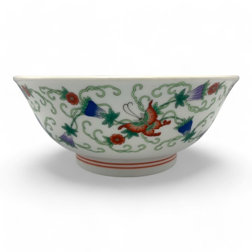 1397 - An antique Chinese Porcelain Bowl with Floral and Butterfly Design. White porcelain with green, red,... 