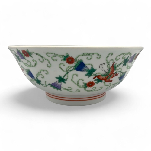 1397 - An antique Chinese Porcelain Bowl with Floral and Butterfly Design. White porcelain with green, red,... 