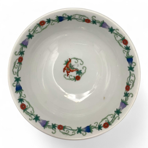 1397 - An antique Chinese Porcelain Bowl with Floral and Butterfly Design. White porcelain with green, red,... 