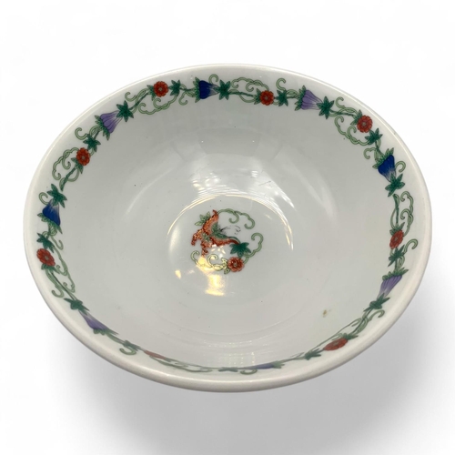 1397 - An antique Chinese Porcelain Bowl with Floral and Butterfly Design. White porcelain with green, red,... 