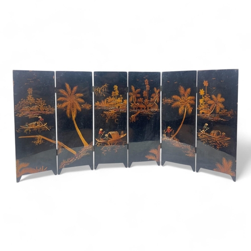 1523 - A vintage Chinese Black Lacquer Folding Screen with Gold Hand-Painted Koi and Landscape Motifs.
Blac... 