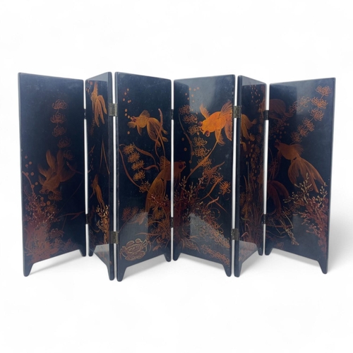 1523 - A vintage Chinese Black Lacquer Folding Screen with Gold Hand-Painted Koi and Landscape Motifs.
Blac... 