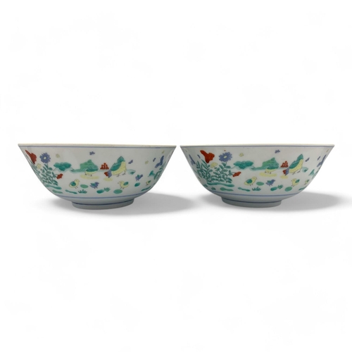 1404 - A Pair of antique Chinese hand painted porcelain Bowls. Markings on base.
White porcelain exterior a... 