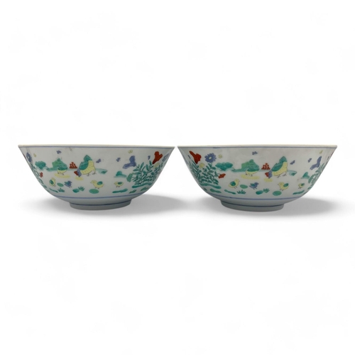 1404 - A Pair of antique Chinese hand painted porcelain Bowls. Markings on base.
White porcelain exterior a... 