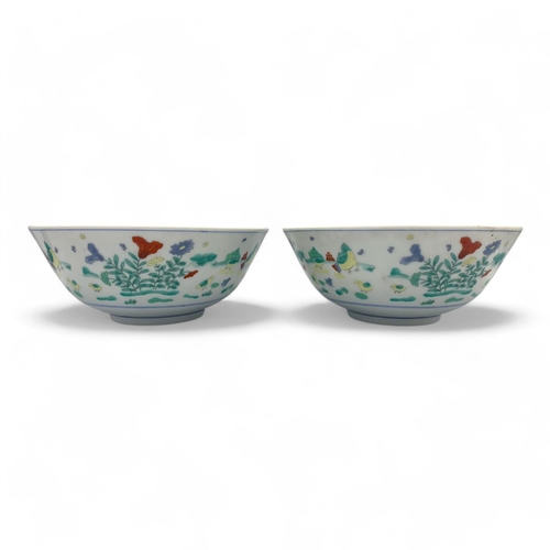 1404 - A Pair of antique Chinese hand painted porcelain Bowls. Markings on base.
White porcelain exterior a... 