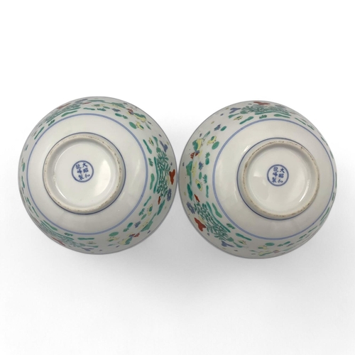 1404 - A Pair of antique Chinese hand painted porcelain Bowls. Markings on base.
White porcelain exterior a... 